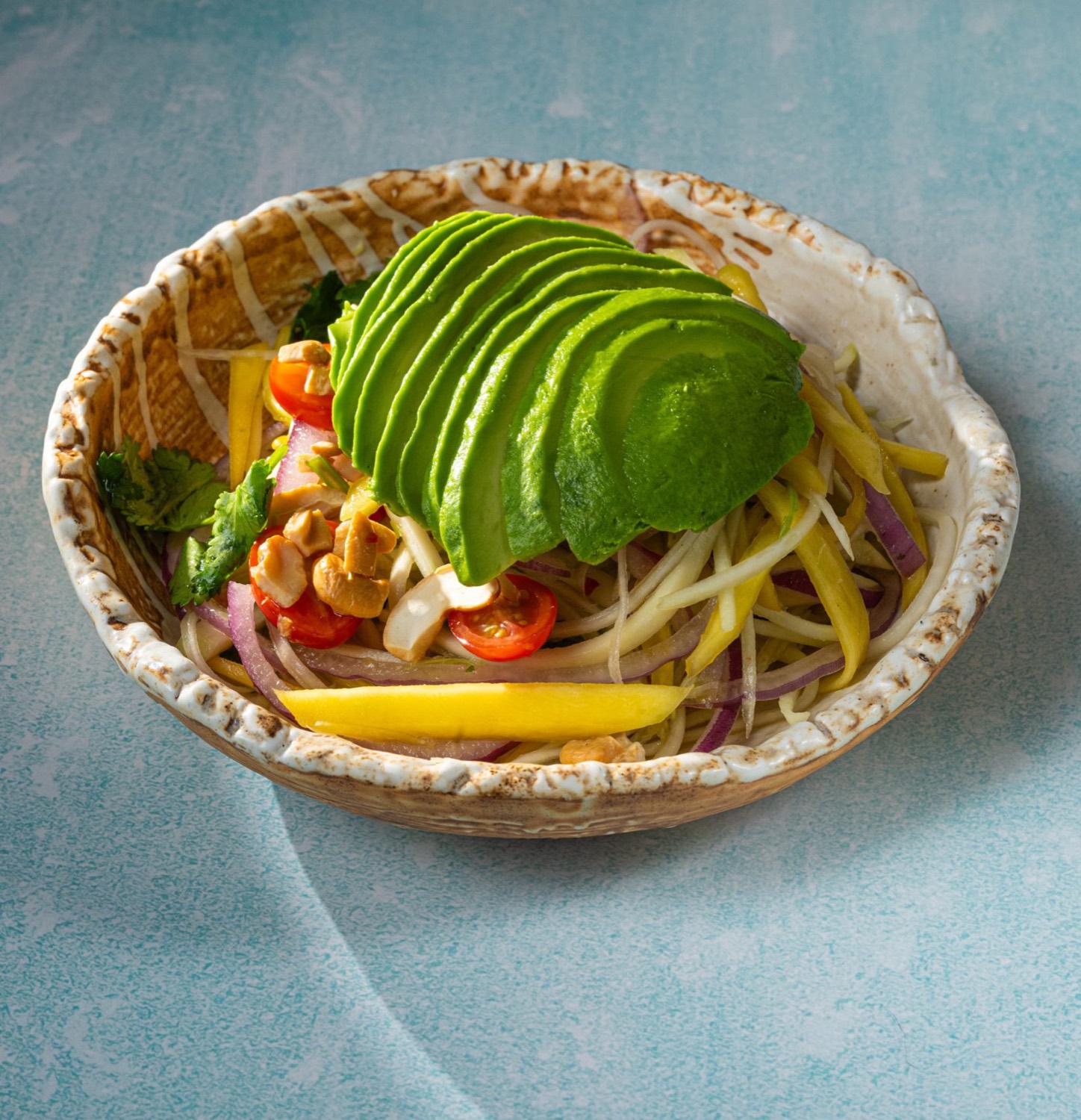 A fresh Thai salad plated at Elephant Ear in NYC's Theater District
