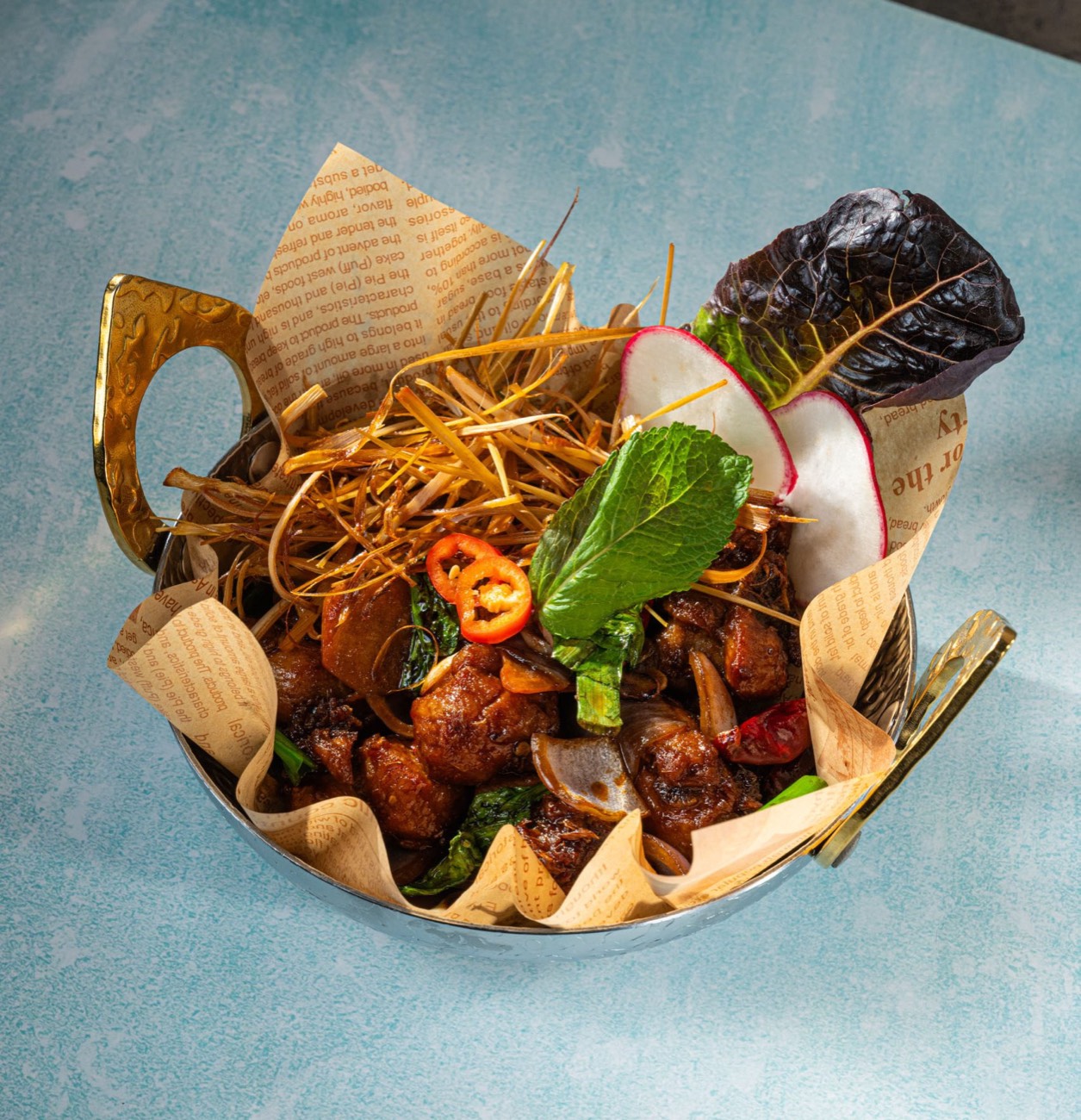 A warm, moody Thai dish served in the Elephant Ear dining room